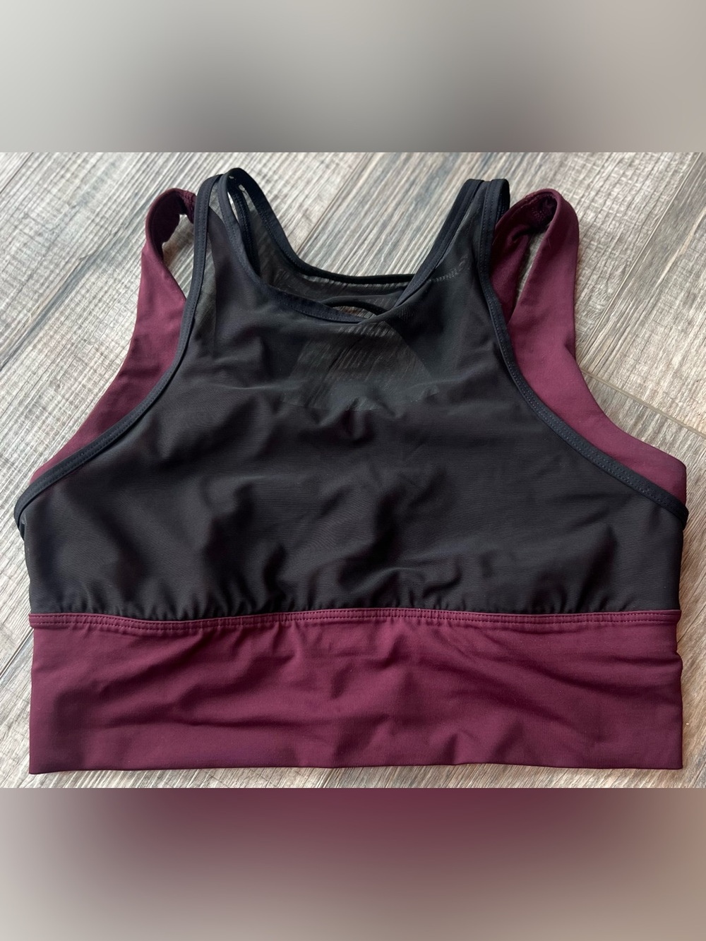Lululemon Double Tap Bra in a maroon color with a black mesh overlay.